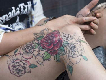 Tattoos abound at Bluesfest, including this rose done by tattoo artist Victoria Rice on herself (she works at Espada Tattoo in Rockland) as day 8 of RBC Bluesfest takes place on the grounds on the Canadian War Museum in Ottawa. Photo by Wayne Cuddington/ Postmedia