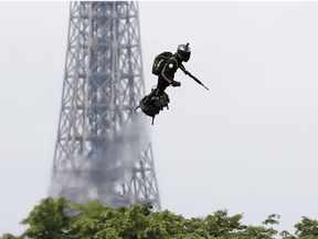 With the Eiffel Tower as a backdrop, Franky Zapata hovers over Paris on a flyboard during the Bastille Day military parade on the Champs-Elysees Avenue earlier this week. France is looking at innovative approaches to defence.