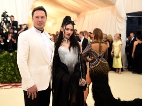 Elon Musk and Grimes attend the Heavenly Bodies: Fashion & The Catholic Imagination Costume Institute Gala at The Metropolitan Museum of Art on May 7, 2018 in New York City.