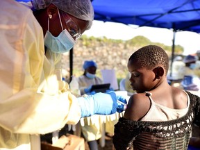 A Congolese health worker administers ebola vaccine to a child at the Himbi Health Centre in Goma, Democratic Republic of Congo, earlier in July.