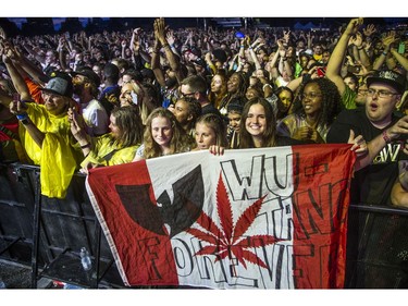 Fans cheered as Wu-Tang hit the City Stage after a delay due to weather at Bluesfest, Saturday, July 13, 2019.