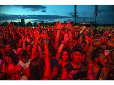 Fans cheered as Wu-Tang hit the City Stage after a delay due to weather at Bluesfest, Saturday, July 13, 2019.