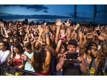 Fans cheered as Wu-Tang hit the City Stage after a delay due to weather at Bluesfest, Saturday, July 13, 2019.