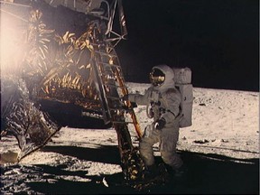 'I felt it was my duty to serve America,' said Alan Bean (show here descending to the lunar surface). He was the fourth man to walk on the moon, as part of the Apollo 12 mission.