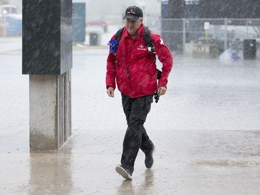 Volunteers and workers head to the Canadian War Museum as Bluesfest is delayed once again. Photo by Wayne Cuddington/ Postmedia