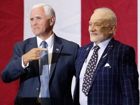 U.S. Vice-President Mike Pence, left, points to Apollo 11 astronaut Buzz Aldrin during an event at the Kennedy Space Center in recognition of the Apollo 11 anniversary, Saturday, July 20, 2019, in Cape Canaveral, Fla.