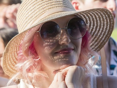 Rachel Devenish, 23, looks on as Nao takes to the City Stage as the 25th anniversary edition of RBC Bluesfest gets underway on the grounds of the Canadian War Museum in Lebreton Flats. Photo by Wayne Cuddington/ Postmedia