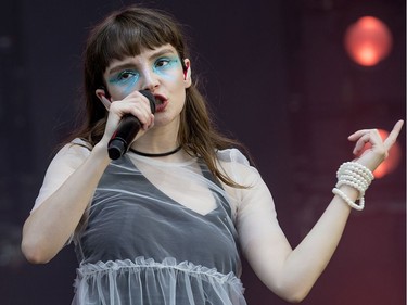 Lauren Mayberry of Chvrches performs on the City Stage as the 25th anniversary edition of RBC Bluesfest gets underway on the grounds of the Canadian War Museum in Lebreton Flats. Photo by Wayne Cuddington/ Postmedia