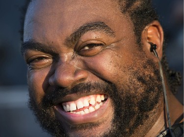 Security guard Rock Bosquet is all smiles despite working up a sweat as the 25th anniversary edition of RBC Bluesfest gets underway on the grounds of the Canadian War Museum in Lebreton Flats. Photo by Wayne Cuddington/ Postmedia