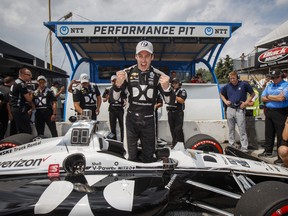 Simon Pagenaud of France celebrates after winning first pole position during qualifying at the 2019 Honda Indy Toronto, in Toronto, Saturday July 13, 2019. THE CANADIAN PRESS/Mark Blinch