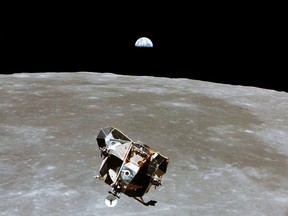 The Apollo 11 Lunar Module ascent stage, with astronauts Neil A. Armstrong and Edwin E. Aldrin Jr. aboard, is photographed from the Command and Service Modules in lunar orbit, July 20, 1969.