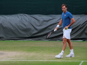 Roger Federer practises in London on Saturday, one day before he faces Novak Djokovic in the Wimbledon men's singles final.