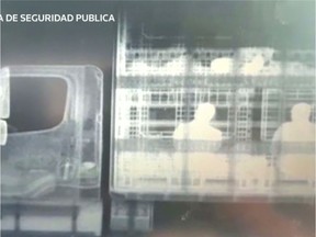 Migrants are seen in a tractor trailer after being detected by police X-ray equipment in Concepcion del Oro, Zacatecas state, Mexico July 7, 2019 in this still image from video footage.