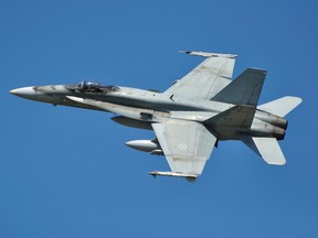 Canadian Forces CF=18 Hornet completes one of several flypasts at CFB Trenton before landing.