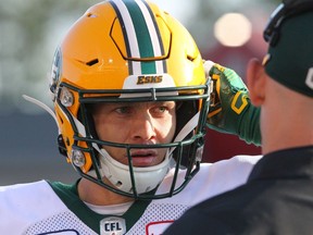 Eskimos quarterback Trevor Harris is seen speaking with coaching staff  on Saturday, August 3, 2019.