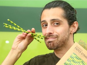 Nick Turenne, Marketing Manager at Terra20, shows off some paper straws on sale there.  Straws come in all shapes and sizes at the Ottawa store: everything from paper and recyclable materials to bamboo, steel and rubber. And many come with their own cleaning brushes inside.