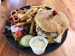 Wild boar burger with salad and fries at Nikosi Bistro Pub in Wakefield
