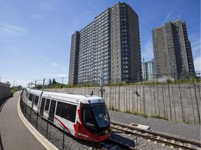 A train on the Confederation Line LRT system near Lees Station.