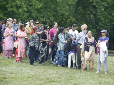 People take part in a BBQ organized by Punjabi Community Health Services Ottawa and the Punjabi School at Vincent Massey Park on Saturday.