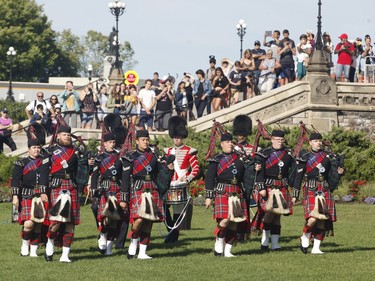 The ceremonial guard takes part in a ceremony on Parliament Hill with "The Rolling Barrage" charity motorcycle ride on Sunday, August 11, 2019.