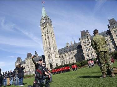 Veterans visit Parliament Hill as part of "The Rolling Barrage" charity motorcycle ride on Sunday, August 11, 2019.