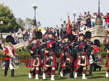 The ceremonial guard takes part in a ceremony on Parliament Hill with "The Rolling Barrage" charity motorcycle ride on Sunday, August 11, 2019.