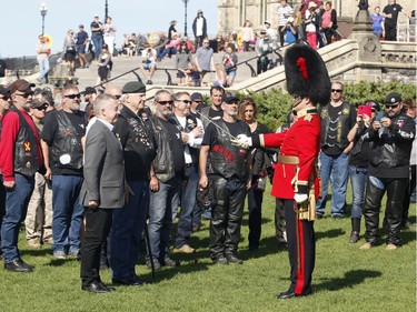 Veterans visit Parliament Hill as part of "The Rolling Barrage" charity motorcycle ride on Sunday, August 11, 2019.