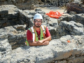 Lead archaeologist Stephen Jarrett stands inside one of the rooms of the barracks.