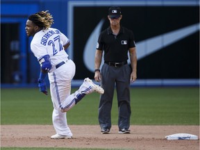 Vladimir Guerrero Jr. of the Toronto Blue Jays rounds second base on his way to third after hitting a triple, scoring two runs in the seventh inning against the New York Yankees at Rogers Centre on Aug. 10, 2019.