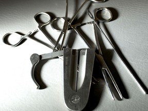 A Mogen clamp, with other tools used in circumcision,