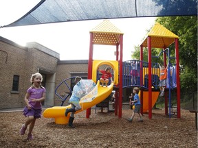 Children play on the new Viscount Alexander Public School play structure. School council raised money and got grants to have it built after the last one was torn down as unsafe.