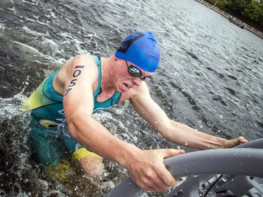 Alec Davison, who would finish second in the Youth and Junior Boys Enduro Race, gets out of the Rideau Canal during the event.