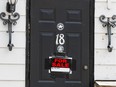 The Outlaws clubhouse at 18 Ladouceur Street in Ottawa with a ForSale by owner sign on the front door. August 12, 2019.