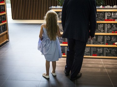 A young girl looks at the tribute to the fallen in the Afghanistan Memorial Hall.