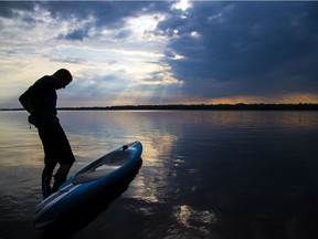Kevin Payan heads out on the Ottawa River from Westboro beach for a paddle.