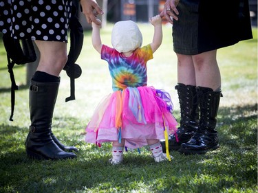 The Ottawa Dyke March 2019 took place on Saturday starting at the Canadian Tribute to Human Rights on Elgin. One-year-old Morgen Steinwand gets a helping hand from her moms Saturday.