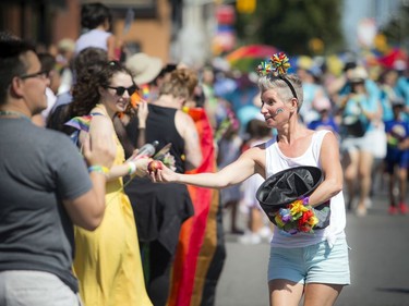Melissa Rainville with Flying Canoe Hard Cider was handing out fresh apples along the parade route Sunday.