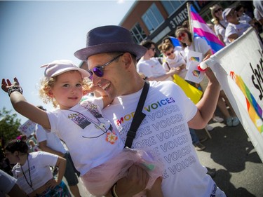 Harley Finkelstein, COO of Shopify, with his daughter Bayley during the parade Sunday.