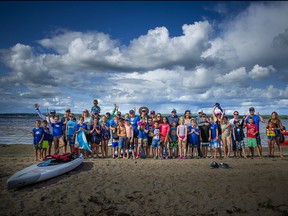 Tons of smiles in the group photo of all the competitors and helpers for the kids' race Saturday.