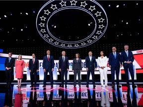 Eight Democratic presidential hopefuls (L-R): US Senator from Colorado Michael Bennet, US Senator from New York Kirsten Gillibrand, former US Secretary of Housing and Urban Development Julian Castro, US Senator from New Jersey Cory Booker, former Vice President Joe Biden, US Senator from California Kamala Harris, US entrepreneur Andrew Yang, US Representative for Hawaii's 2nd congressional district Tulsi Gabbard, Governor of Washington Jay Inslee and Mayor of New York City Bill de Blasio.