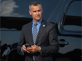 Corey Lewandowski, former campaign manager for US President Donald Trump, watches as Trump disembarks from Air Force One upon arrival at Cincinnati/Northern Kentucky International Airport in Hebron, Kentucky, August 1, 2019, as he travels to Cincinnati, Ohio, to hold a campaign rally.