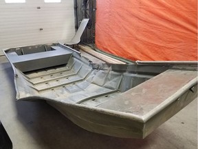 This image released on August 4, 2019 by the Royal Canadian Mounted Police (RCMP)shows a damaged aluminium boat they found on the shore of the Nelson river as they are searching for Kam McLeod and Bryer Schmeglsky. - Kam McLeod and Bryer Schmegelsky have been on the run since 23-year-old Australian Lucas Fowler and his American girlfriend Chynna Deese, 24, were found shot dead alongside the Alaska Highway in northern British Columbia. McLeod, 19, and Schmegelsky, 18, were last spotted on July 22 in the Gillam region, more than 620 miles (1,000 kilometers) north of the Manitoba capital Winnipeg.