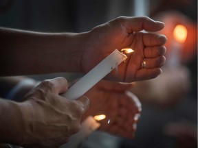 People light candles during a prayer and candle vigil organized by the city, after the shooting that left 20 people dead at the Cielo Vista Mall WalMart in El Paso, Texas, on August 4, 2019. - The United States mourned Sunday for victims of two mass shootings that killed 29 people in less than 24 hours as debate raged over whether President Donald Trump's rhetoric was partly to blame for surging gun violence. The rampages turned innocent snippets of everyday life into nightmares of bloodshed: 20 people were shot dead while shopping at a crowded Walmart in El Paso, Texas on Saturday morning, and nine more outside a bar in a popular nightlife district in Dayton, Ohio just 13 hours later.