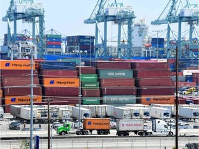 Container trucks arrive at the Port of Long Beach on August 23, 2019 in Long Beach, California. - President Donald Trump hit back at China on August 23, 2019, in their mounting trade war, raising existing and planned tariffs in retaliation for Beijing's announcement earlier in the day of new duties on American goods.