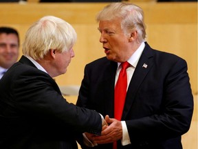 FILE PHOTO: U.S. President Donald Trump shakes hands with Boris Johnson.