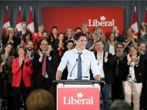 Prime Minister Justin Trudeau receives a standing ovation while addressing Liberal Party candidates in Ottawa on July 31. Think how enthusiastic they'd have been if he'd kept some key promises.