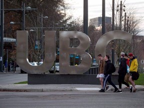 A B.C. Supreme Court judge has awarded author Steven Galloway access to emails between a woman who accused of him of sexual assault and staff at the University of British Columbia in the first test of a provincial law intended to protect freedom of expression. People walk past large letters spelling out UBC at the University of British Columbia in Vancouver on Nov. 22, 2015.