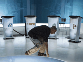 A technician prepares the set in preparation for a federal leaders debate, Sept. 23, 2015 in Montreal.