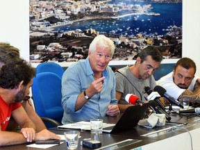 Founder and director of Proactiva Open Arms NGO Oscar Camps, Head of mission of Proactiva Open Arms NGO Riccardo Gatti, U.S. actor Richard Gere and Italian chef Gabriele Rubini (known as Chef Rubio), attend a news conference in support of an NGO ship "Open Arms", which carries stranded migrants, in Lampedusa, Italy, August 10, 2019.