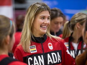 Tennis star Genie Bouchard shares a moment with fellow athletes as Team Canada's Rio 2016 athletes and coaches attend events held at the University of Ottawa to celebrate their achievements during the Summer Olympic Games.